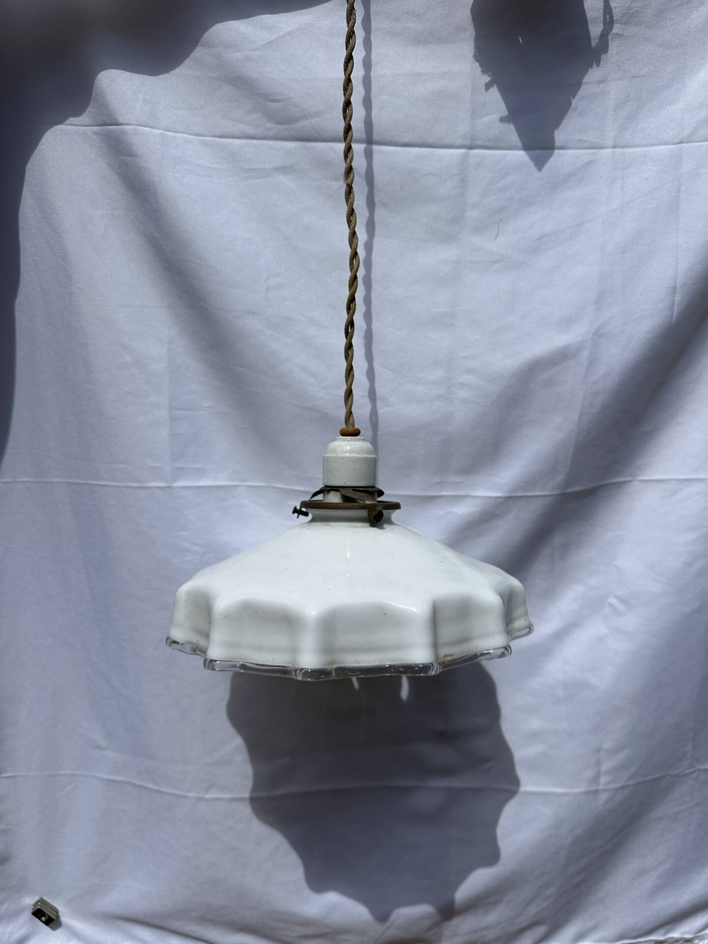 Vintage pleated opaline suspension with porcelain fittings.