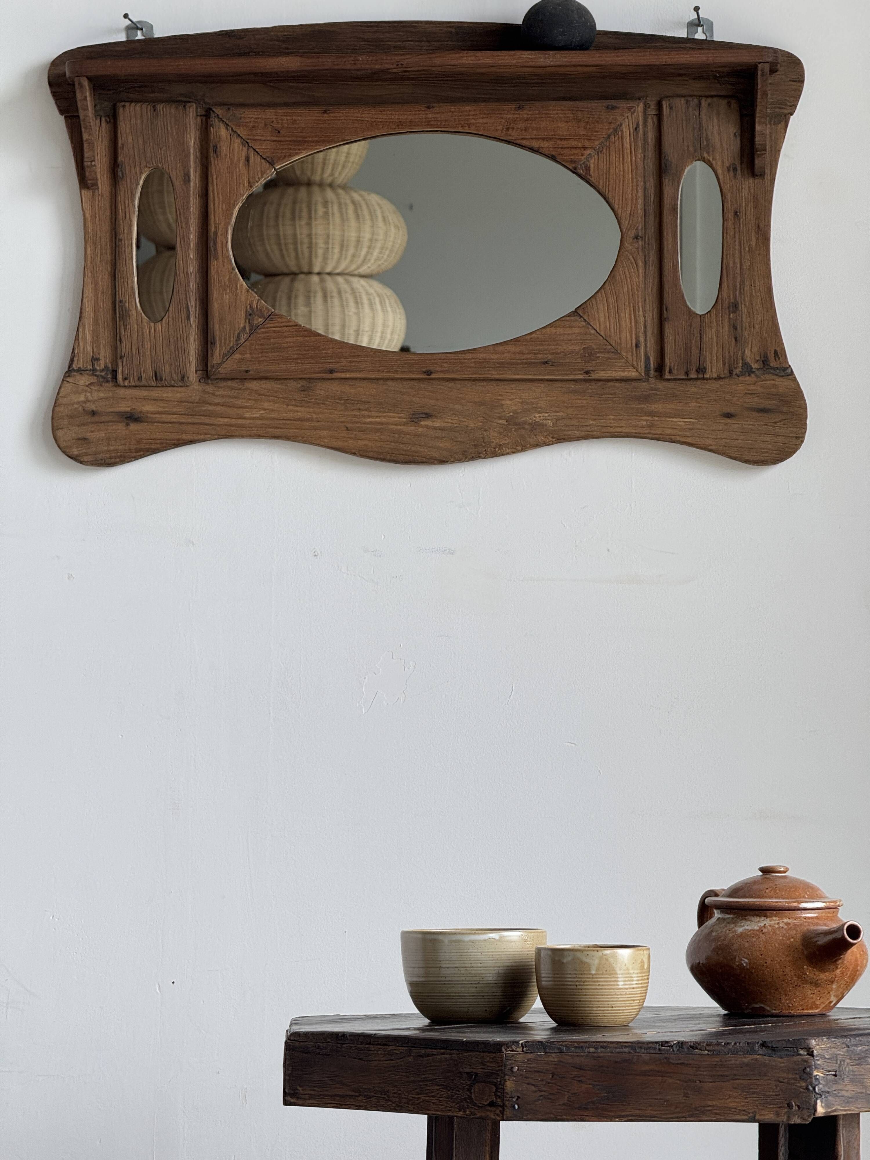 Small wall mirror in organic old Indonesian teak 75x45.
