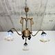 Art Nouveau chandelier with three arms and opalescent iridescent glass.