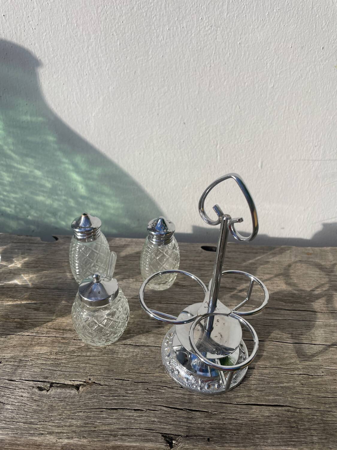 Silver-plated metal and glass salt and pepper shakers