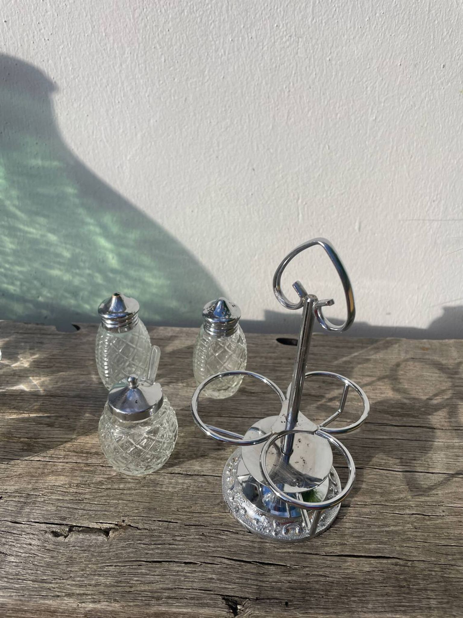 Silver-plated metal and glass salt and pepper shakers