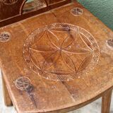 Old Swiss escabelle chair in carved wood