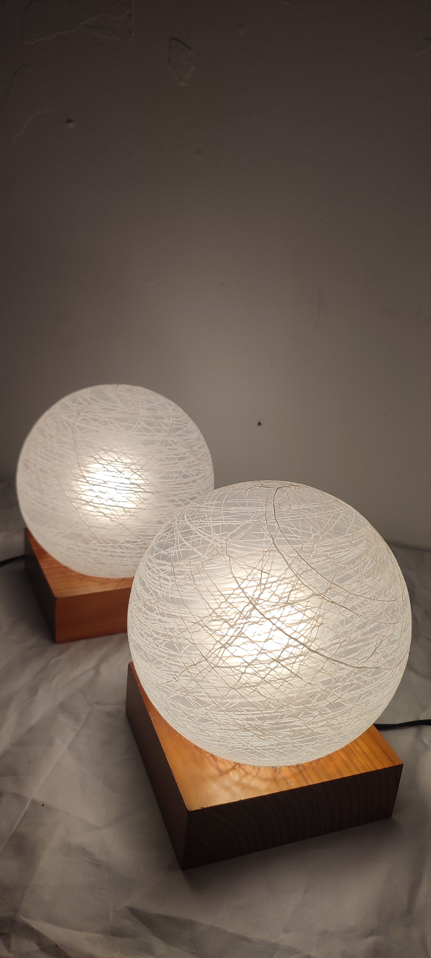 Pair of wooden and glass table lamps. Italy, 1970s.