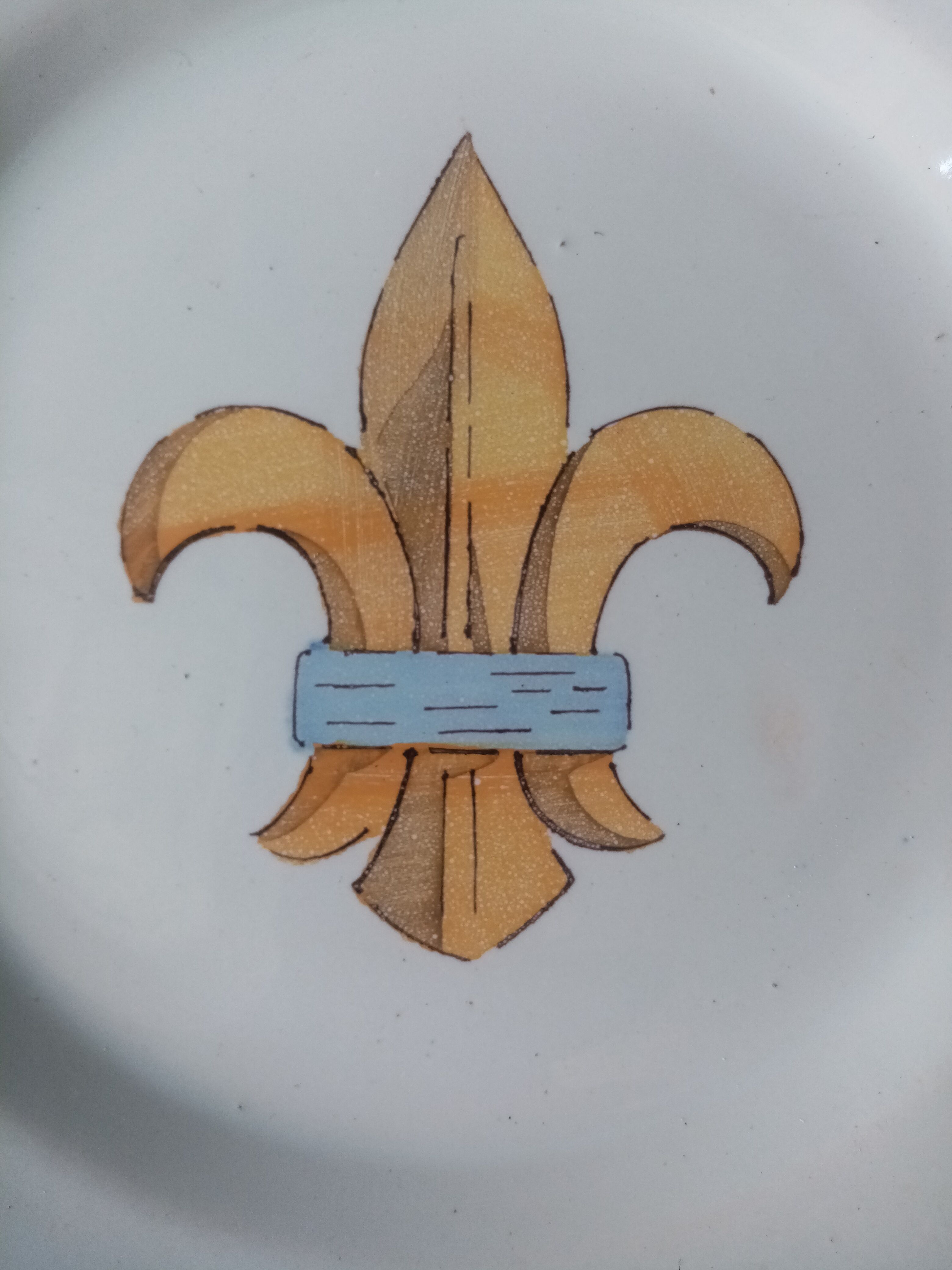 18th century earthenware decorative plate signed Saint Clement with royal coat of arms decoration