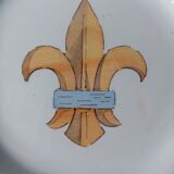 18th century earthenware decorative plate signed Saint Clement with royal coat of arms decoration