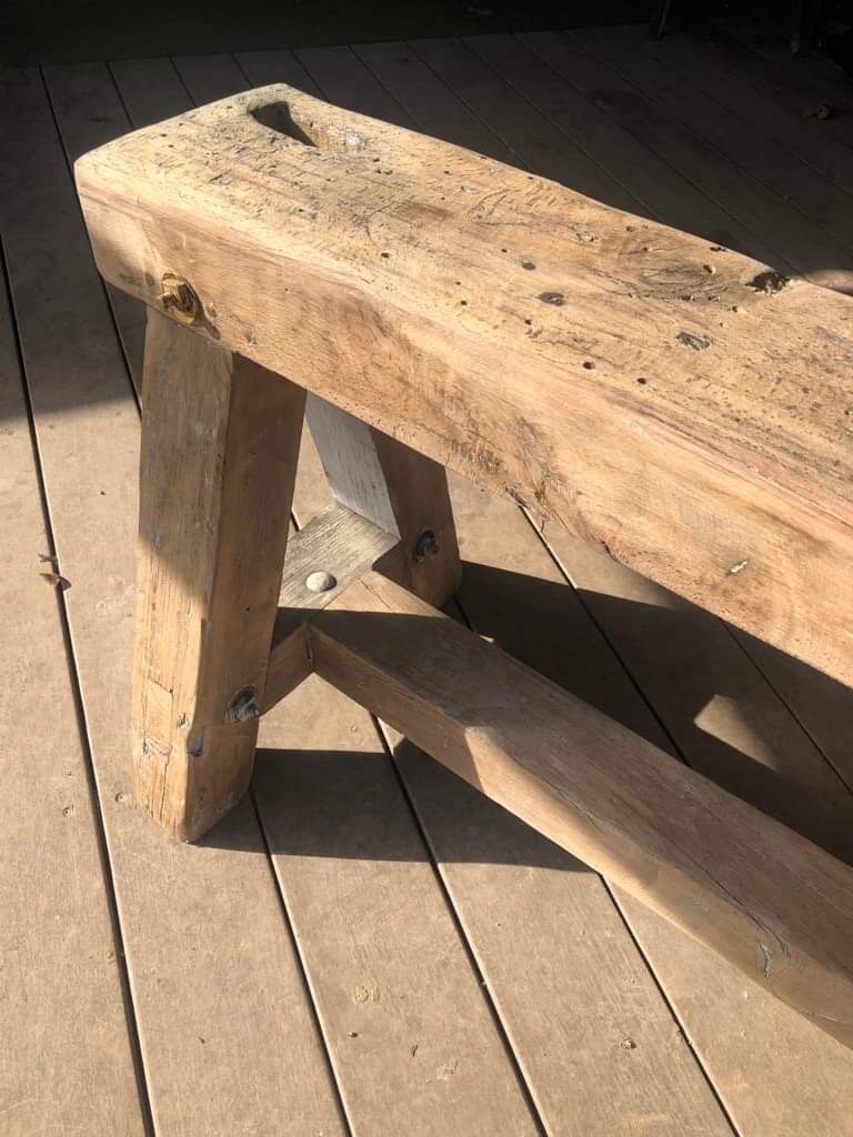 Trestle-shaped wooden bench