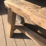 Trestle-shaped wooden bench