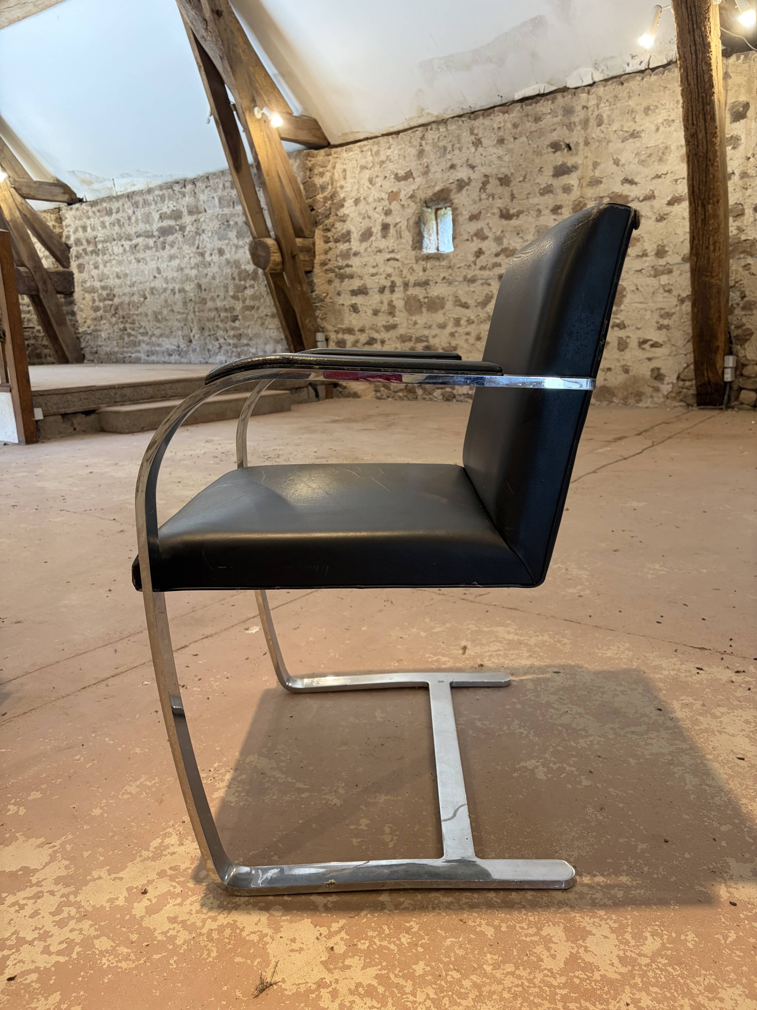 Pair of Executive Chairs by Knoll attributed to Charles Pollock in black leather.