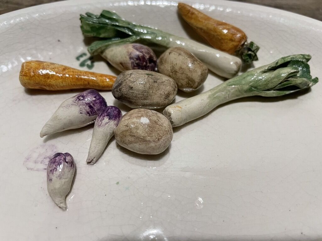 3 plates decorated with vegetables