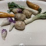 3 plates decorated with vegetables