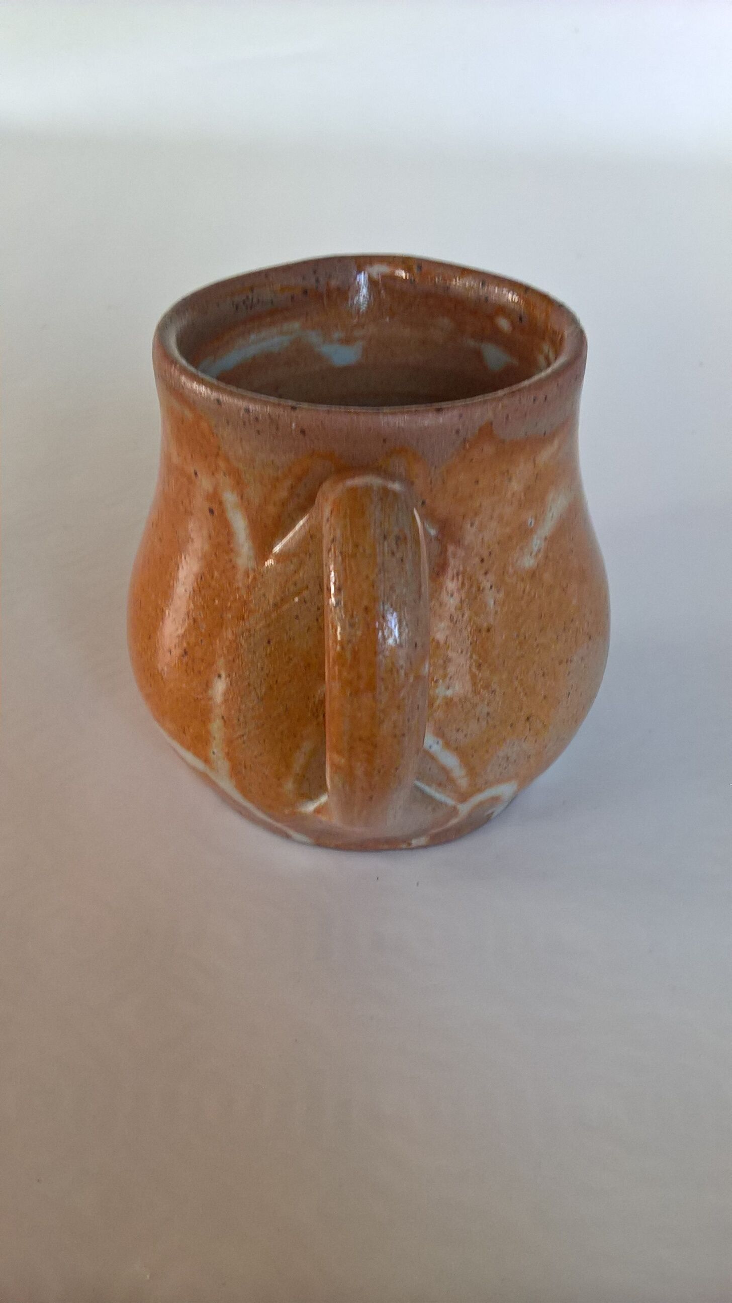 Creamy milk pot in sandstone