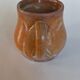 Creamy milk pot in sandstone