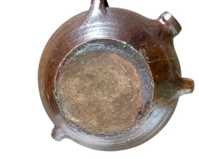 Old stoneware flask known as a toad from the 19th century.