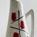 Ceramic flower pitcher.