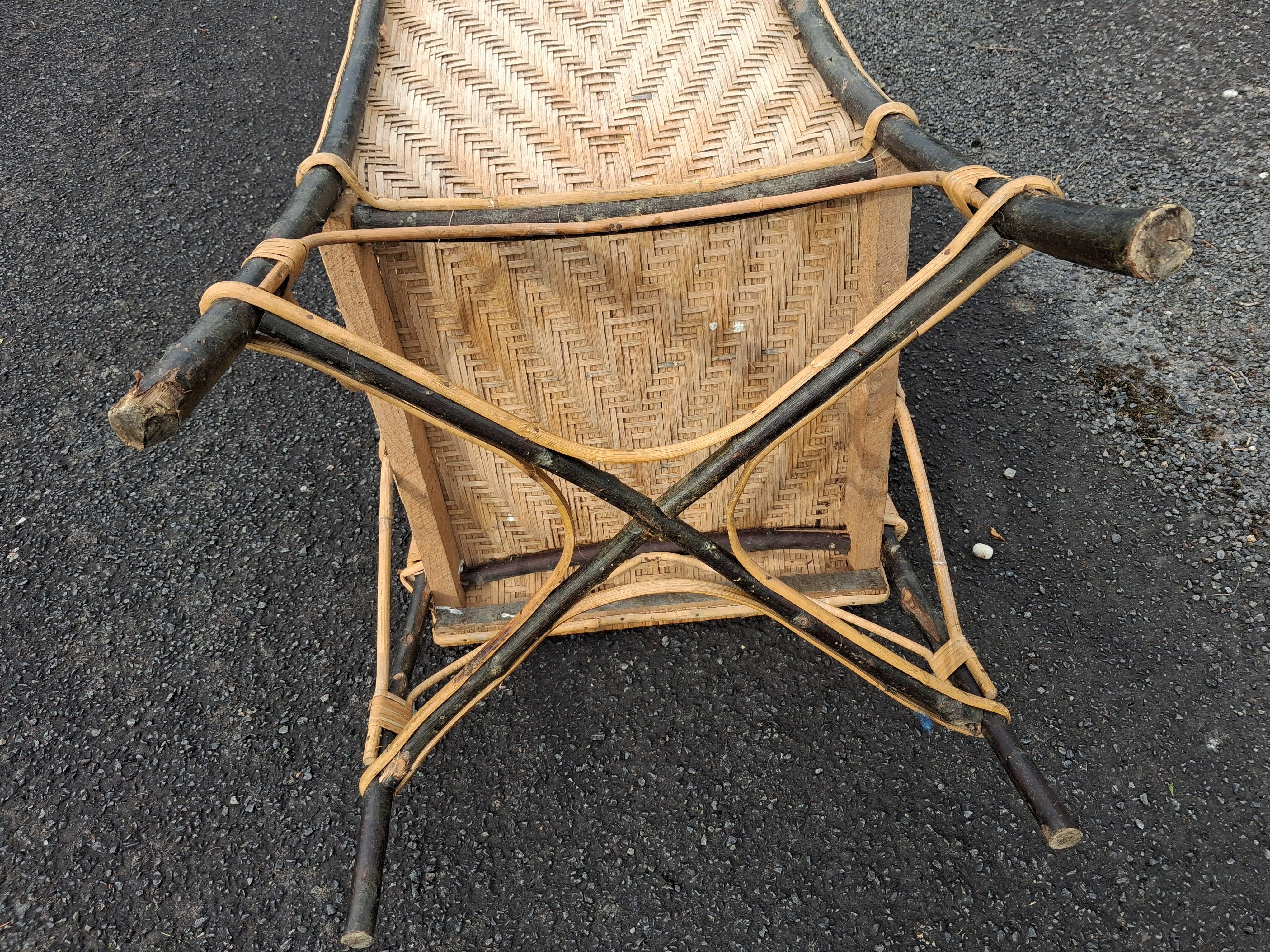 Antique high-back rattan armchair