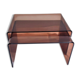 Pair of vintage smoked plexiglass nesting tables.