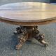 Oval hunting table in solid wood with dragon decoration.