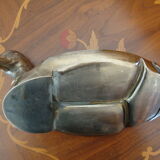 Empty pocketed old duck in solid brass