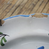 Old earthenware plate with wall support: floral decor