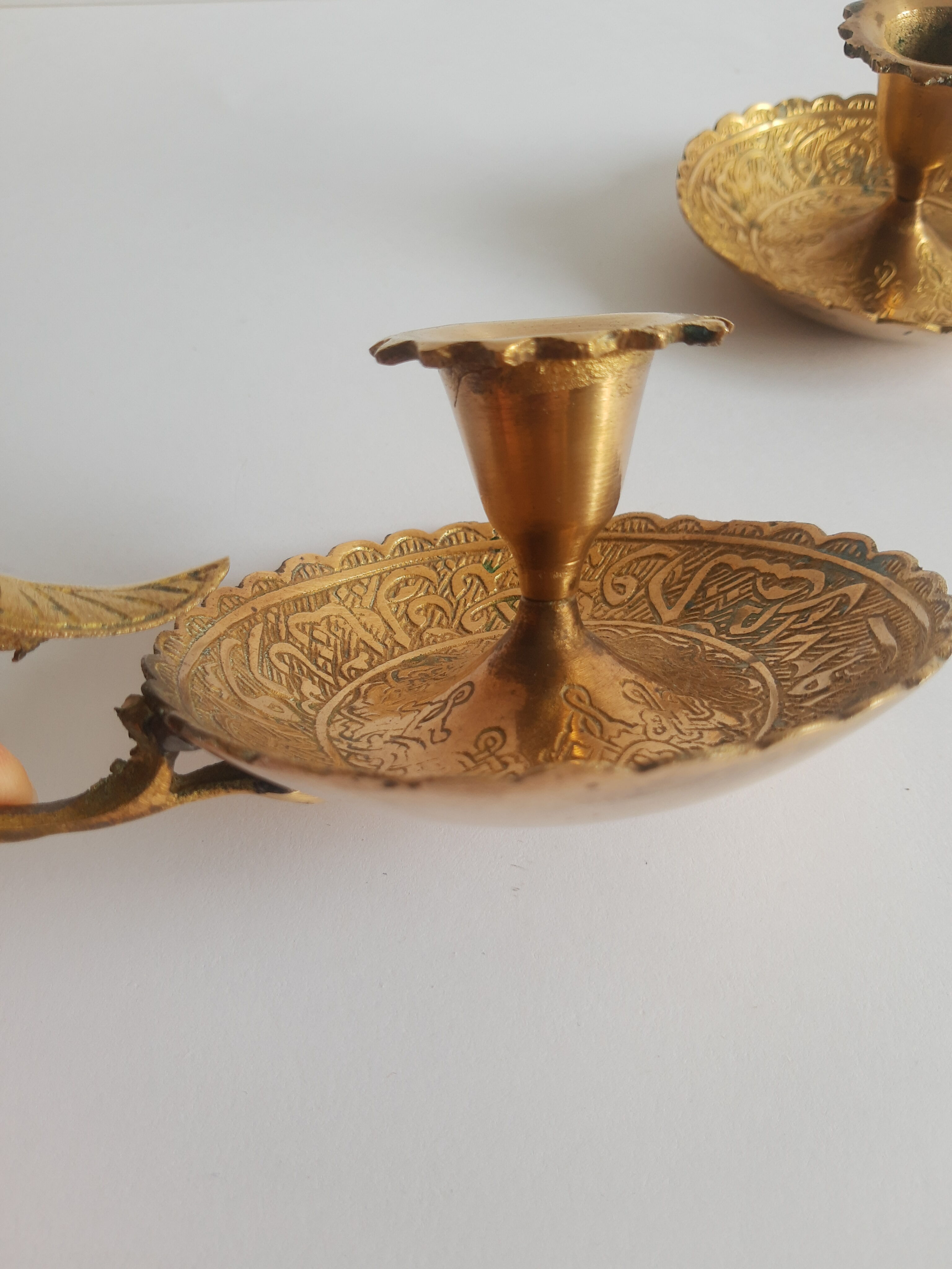 Pair of vintage oriental golden brass cellar candlesticks