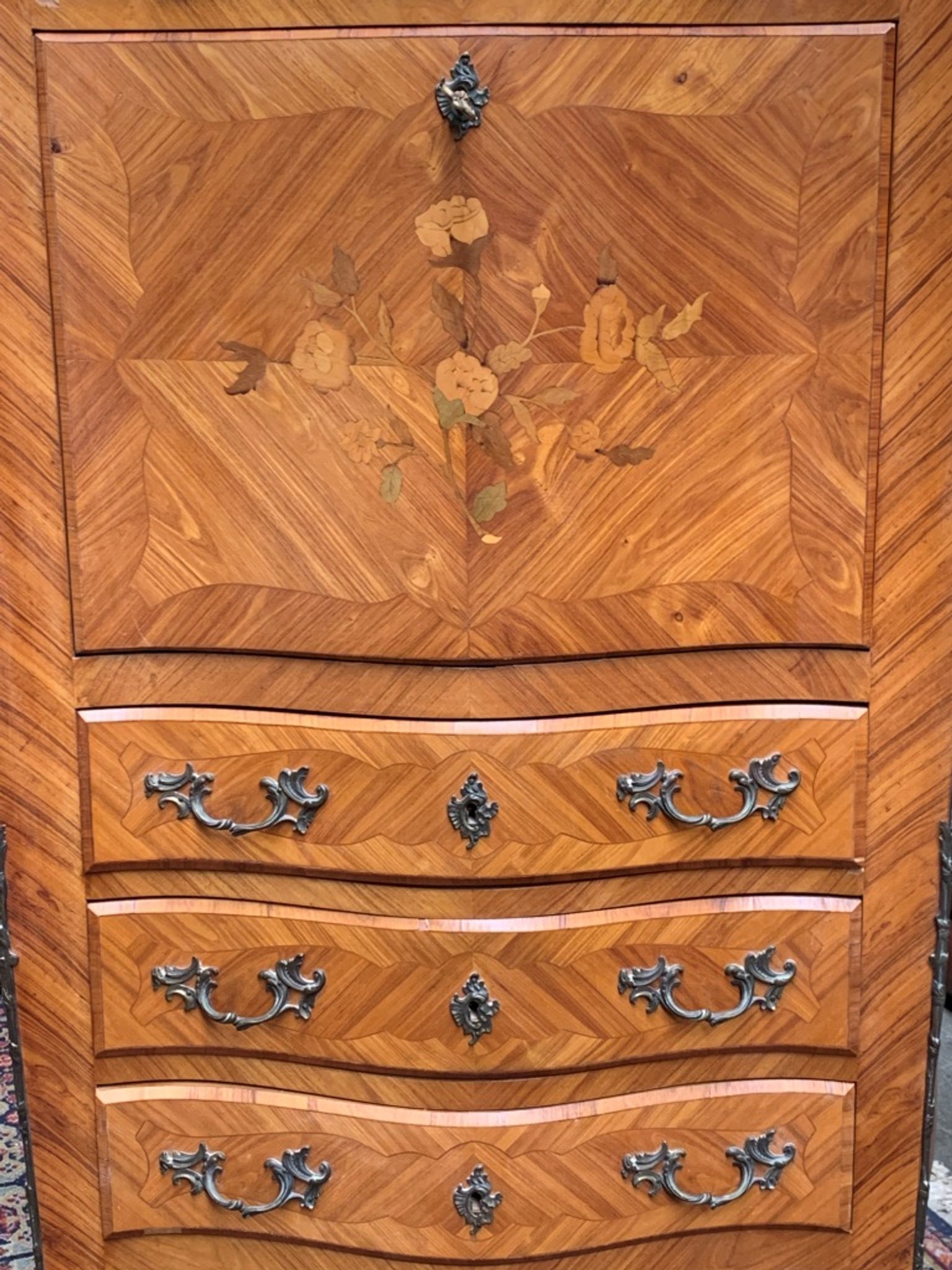 Old French secretary in bronze and wood marquetry.