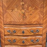 Old French secretary in bronze and wood marquetry.