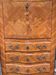 Old French secretary in bronze and wood marquetry.