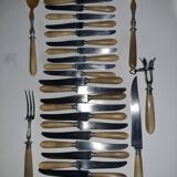 29-piece horn cutlery set, knives and serving utensils.