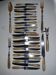 29-piece horn cutlery set, knives and serving utensils.