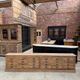 Large workshop furniture transformed into a TV unit.