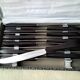 Box of 12 vintage table knives in stainless steel and brown bakelite