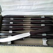 Box of 12 vintage table knives in stainless steel and brown bakelite