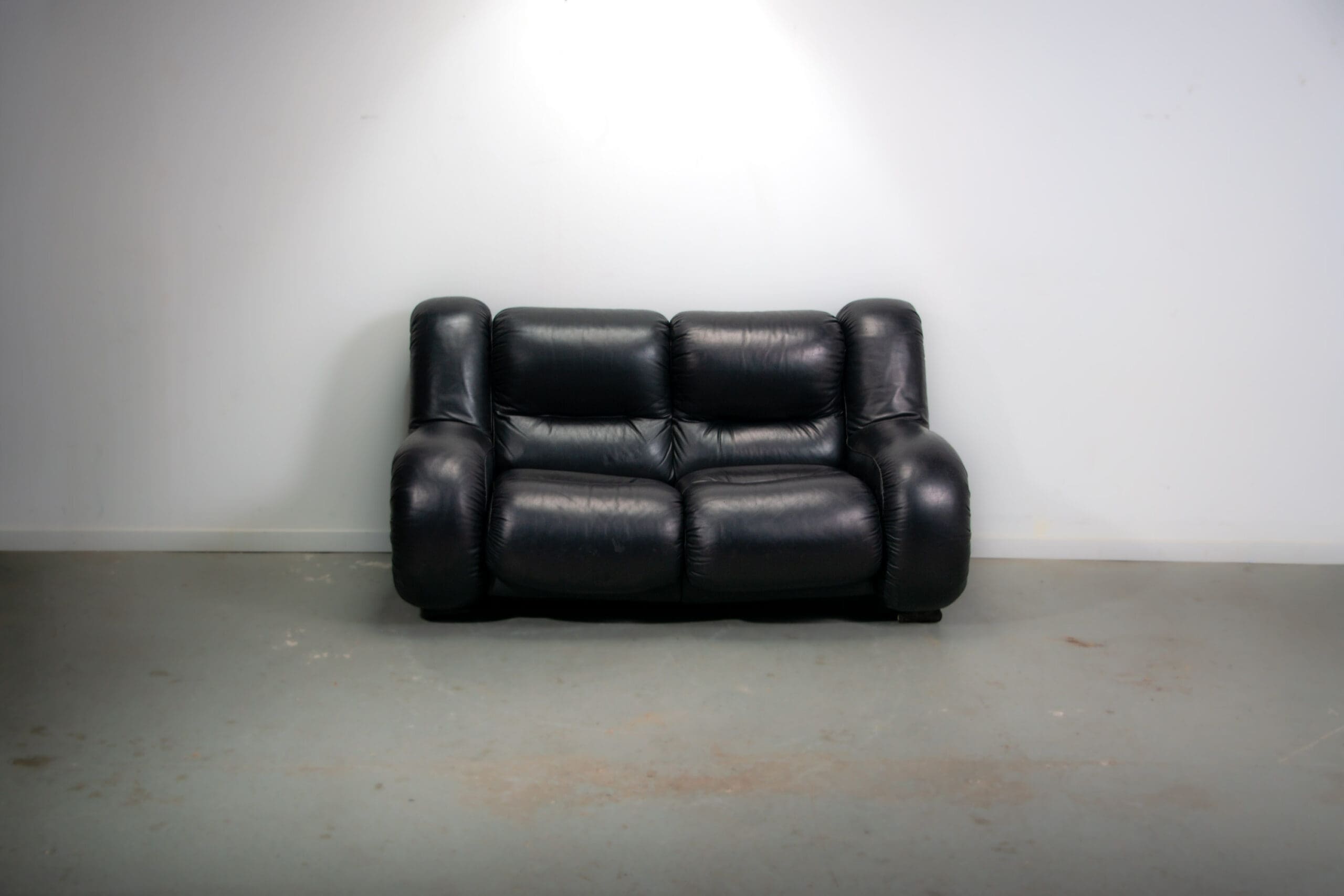 Black leather space age Italian 2 seater sofa