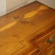 Vintage buffet made of mottled yew wood with three doors and four drawers.