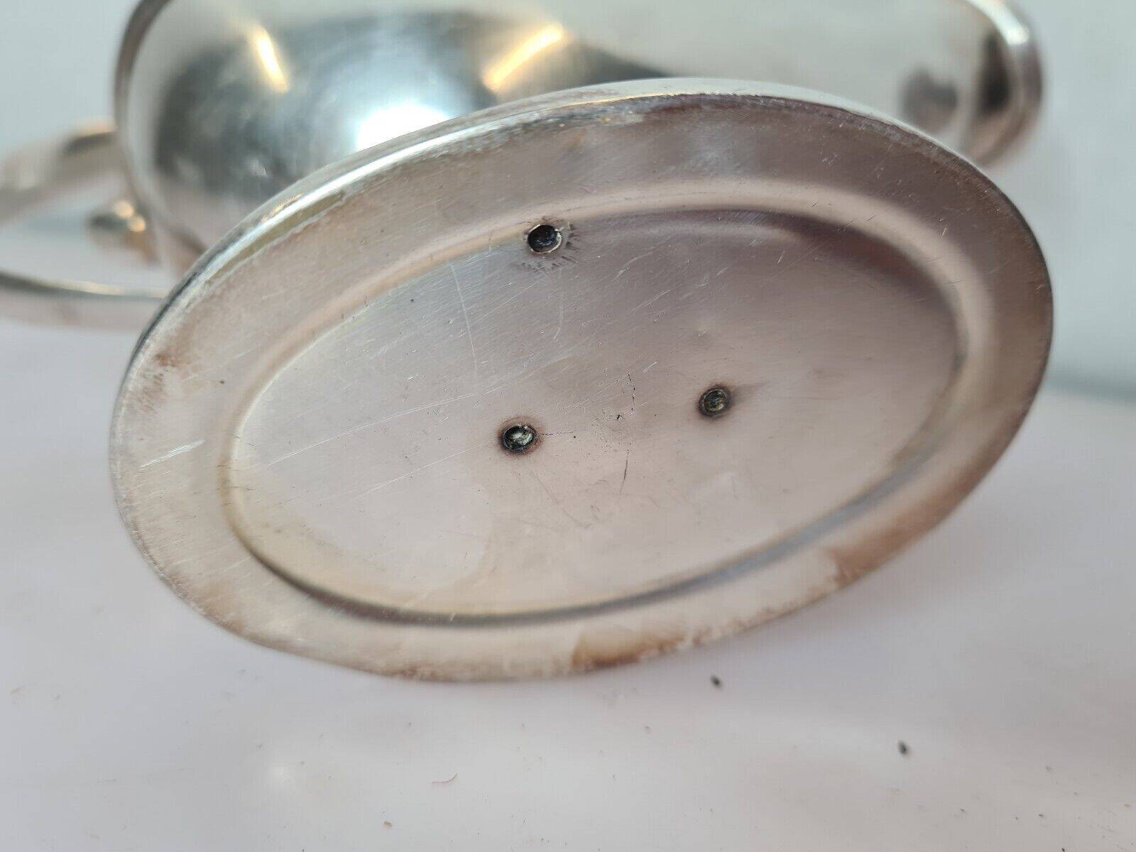 silver metal gravy boat