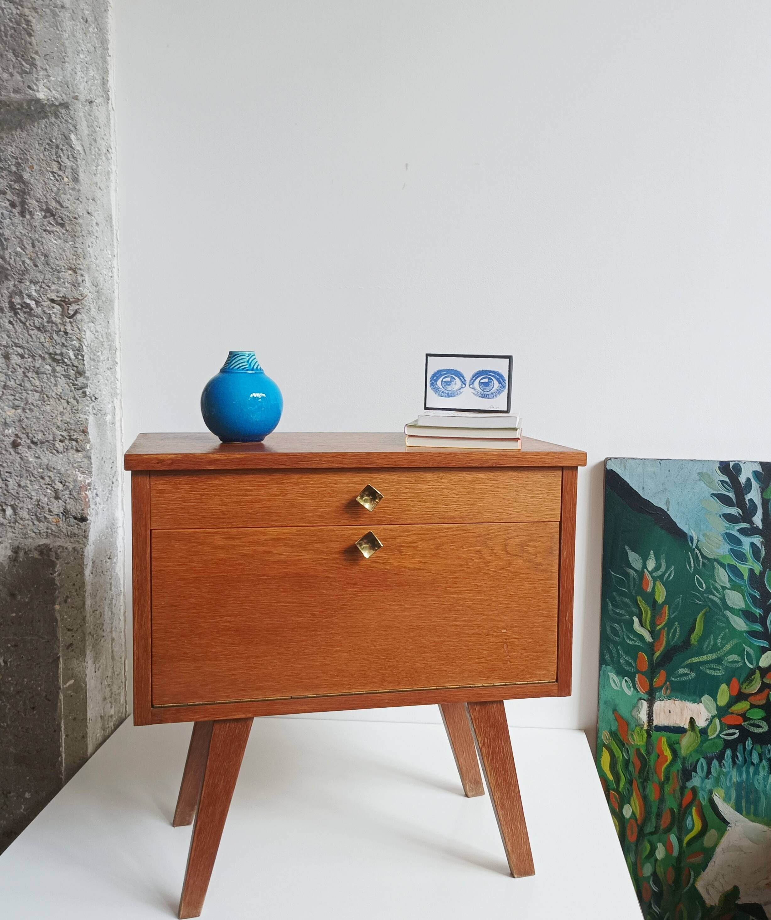 Wooden bedside table with vintage compass legs
