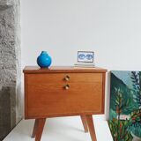 Wooden bedside table with vintage compass legs