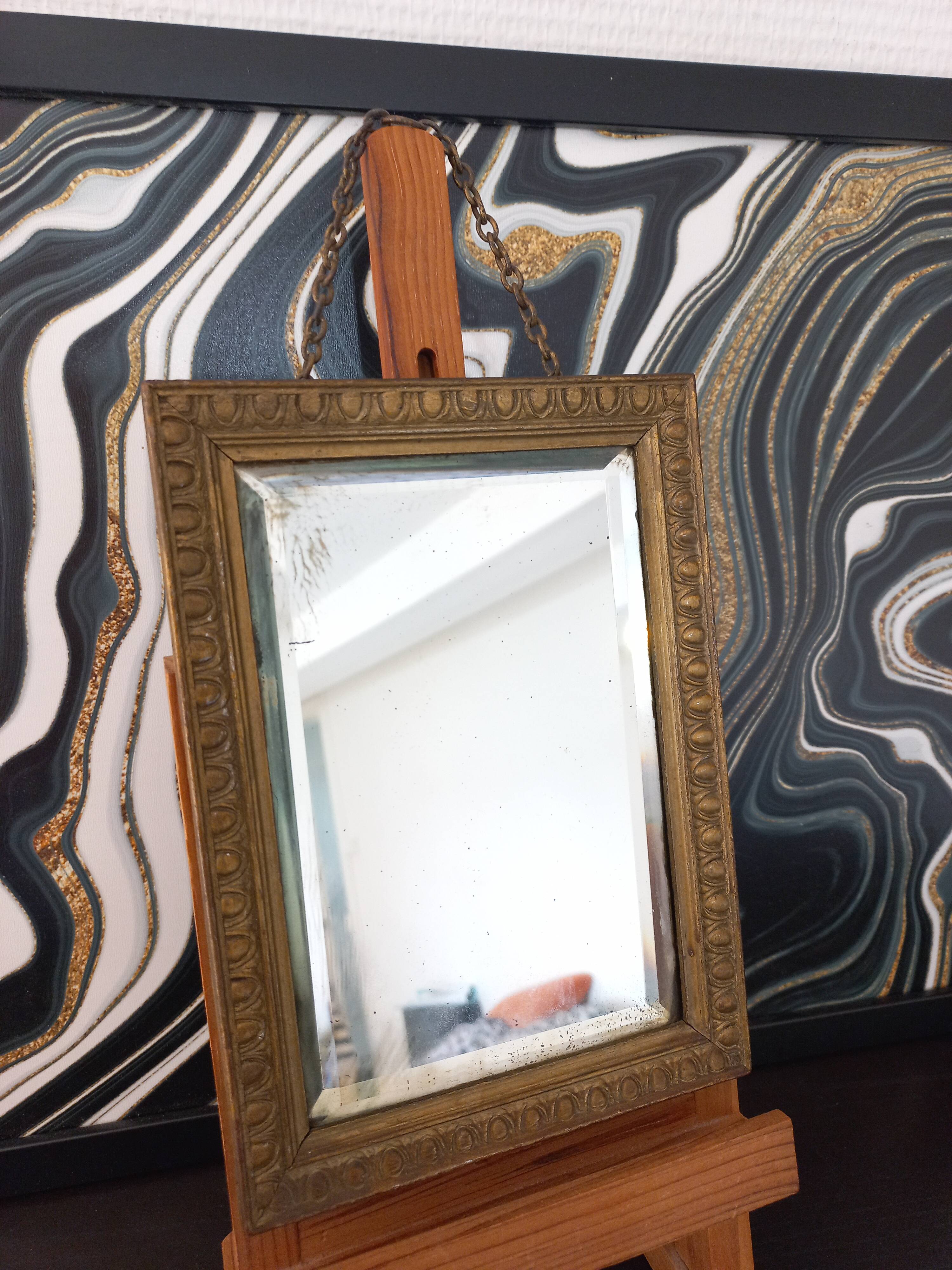Small vintage mirror in gilded wood, bevelled glass with chain.