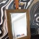 Small vintage mirror in gilded wood, bevelled glass with chain.