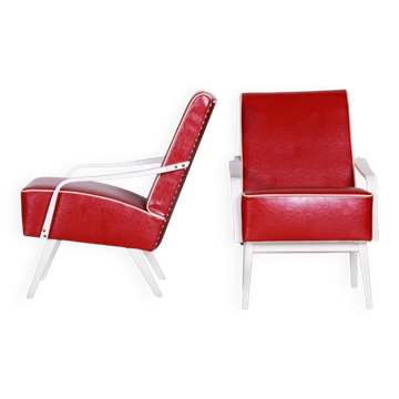 Paire de fauteuils en cuir rouge et hêtre du milieu du siècle, République tchèque, années 1950