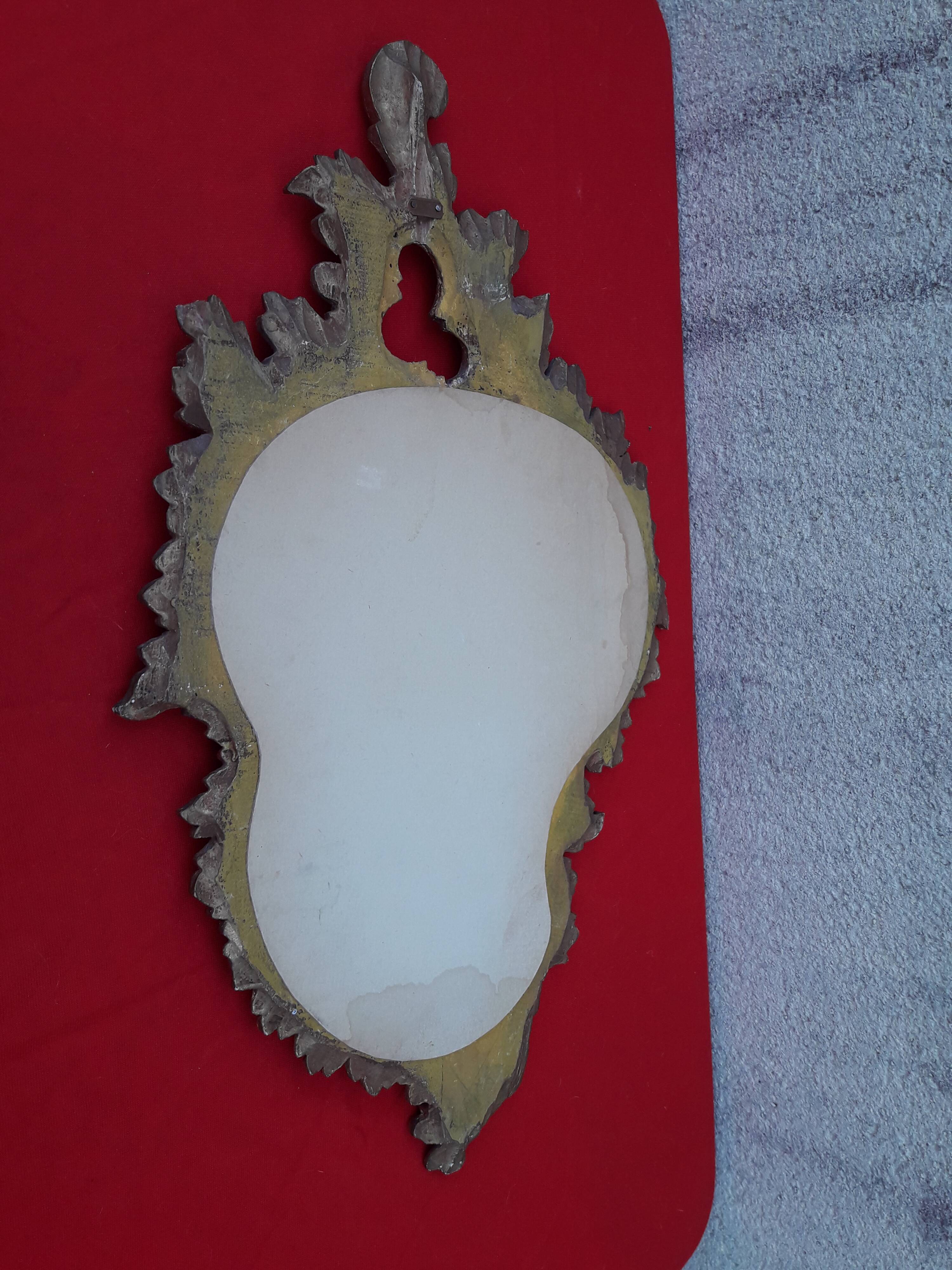 Louis XV style rocaille mirror in wood and gilded stucco