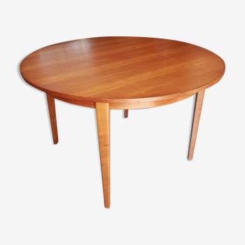 Round extendable teak dining table from the 60s