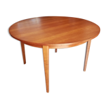 Round extendable teak dining table from the 60s
