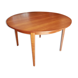 Round extendable teak dining table from the 60s