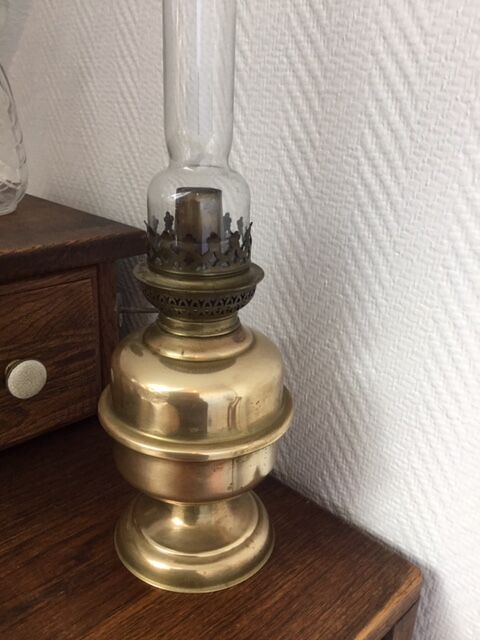 Old-fashioned brass standing oil lamp
