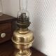 Old-fashioned brass standing oil lamp