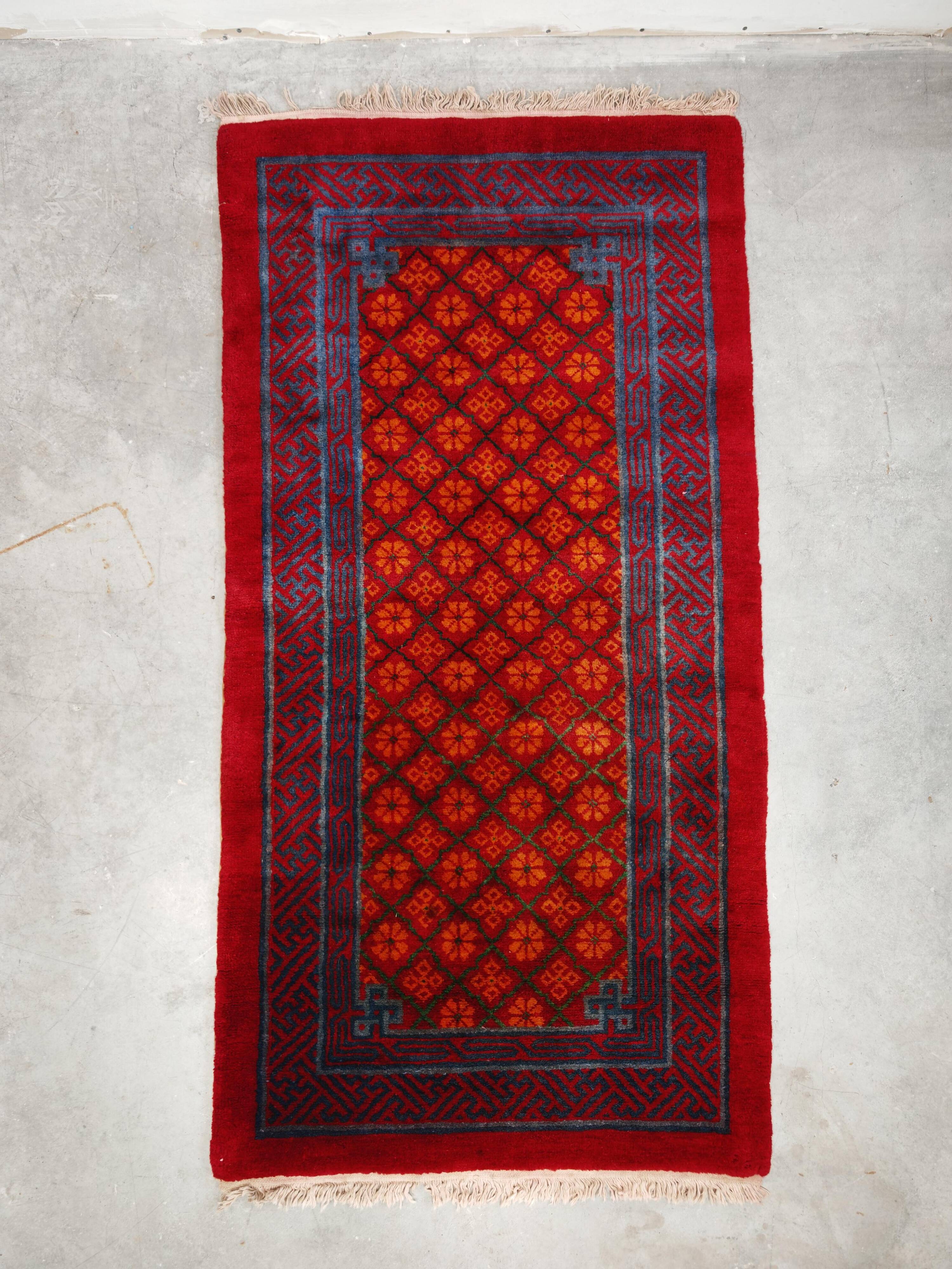 Ancient Khotan carpet, hand-knotted, floral pattern, Turkestan, 1960s.
