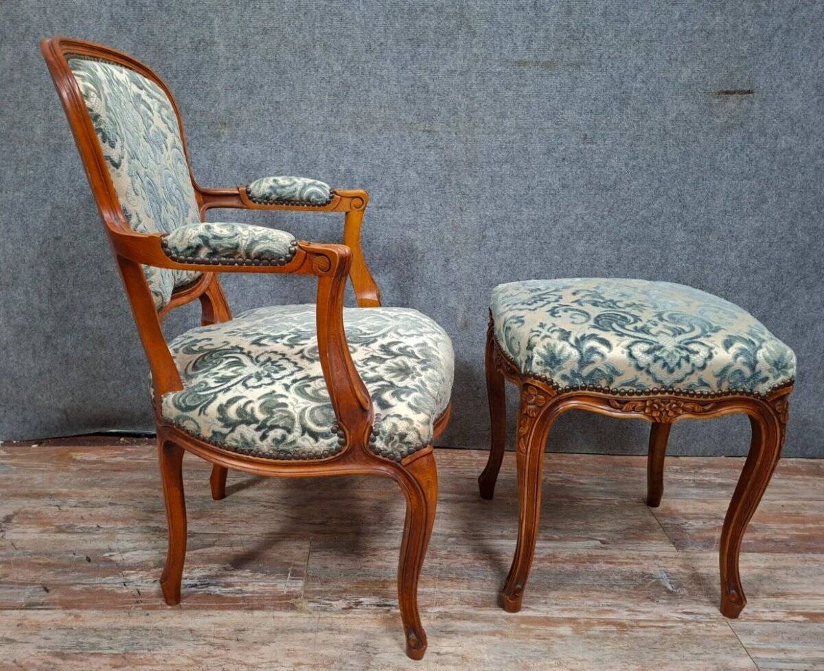 Cabriolet armchair in cherry wood with its footrest, 20th century.