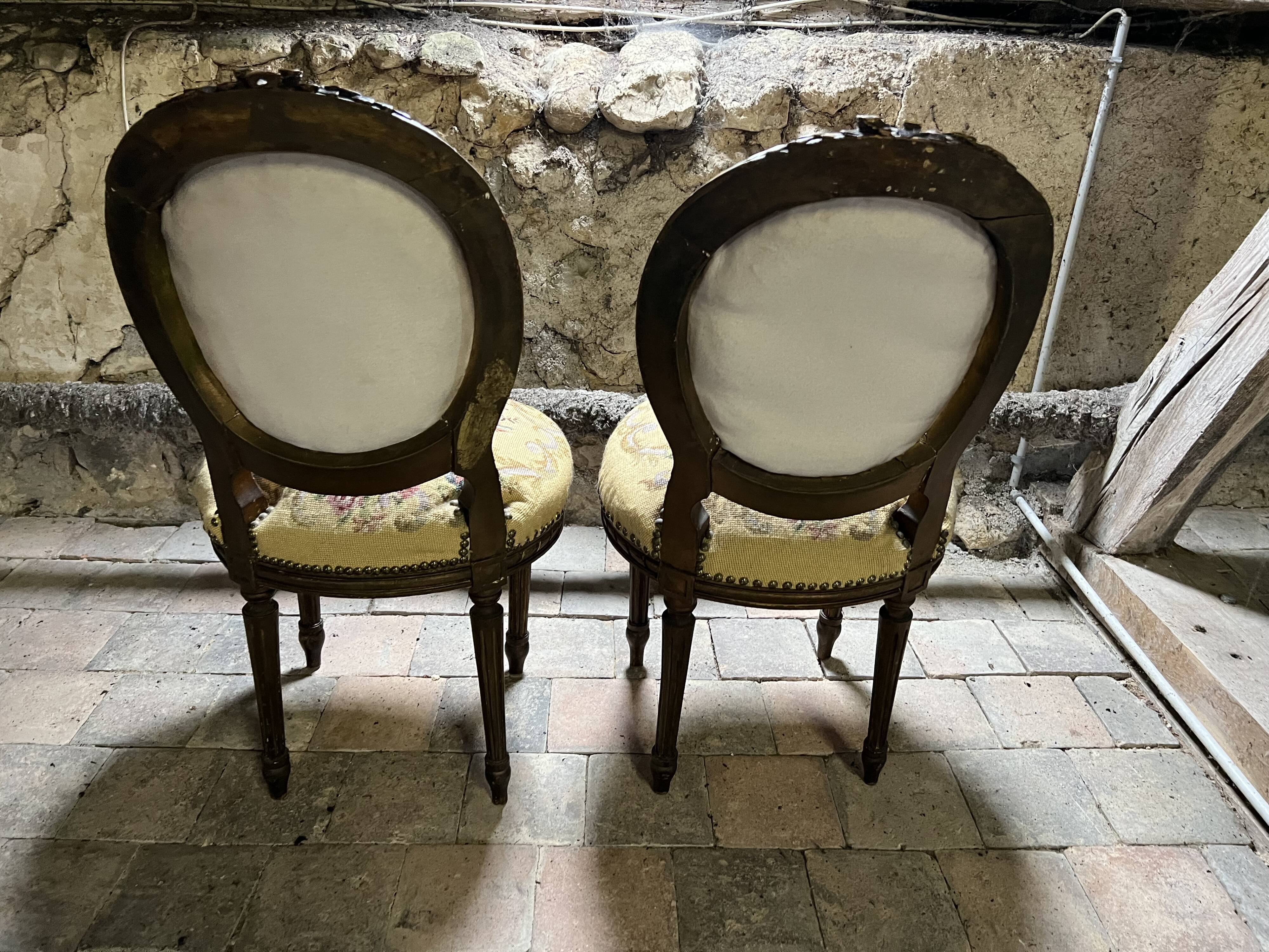 pretty pair of Louis XVI style chairs, in carved and gilded wood