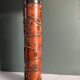 Table lamp with a solid wood printing roll and floral lampshade.